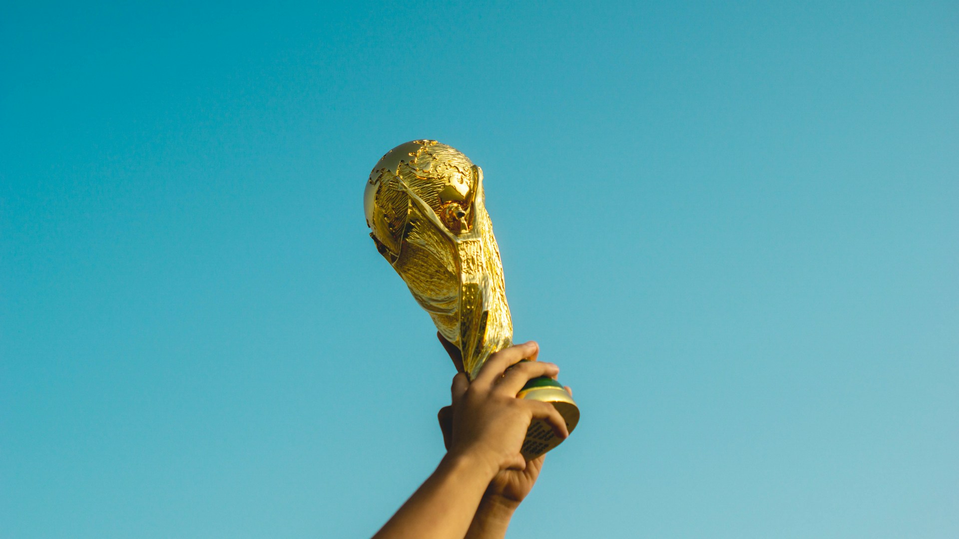 Football fans celebrating at a stadium during a major tournament — fans need reliable mobile data wherever the matches take them